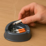 Oblivion plastic ashtray featuring three cigarette holder slots in grey