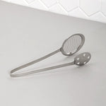 Polished steel serving tong with dual mesh and perforated sides for draining food
