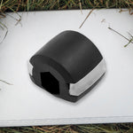 Side profile of the black Jaw Exerciser, showing its compact size.