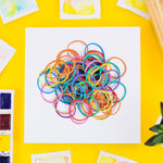 Assorted multicolor elastic bands serving office, school, and home needs.