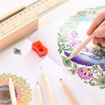 Top-down view of twelve colorful wooden pencils laid out in a fan shape.