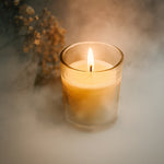 The Scented Votive Candle illuminating a cozy living space, enhancing home fragrance.