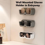 Demonstration of the sunglasses holder installation, highlighting its strong adhesive backing.