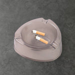 Heat resistant and sturdy plastic ashtray with cigarette grooves