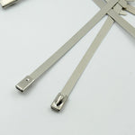 WipeTech's corrosion-resistant stainless steel cable fasteners against a metallic background.