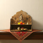 Wooden pooja mandir with top platform and lower shelf for idols and essentials