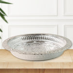 Decorative plastic pooja thali featuring silver finish and floral embossing