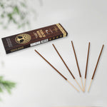 Close-up of unlit mixed floral incense sticks, showing their natural texture.