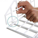 The compact, foldable design of the 5-layer clothes hanger, perfect for small wardrobes.