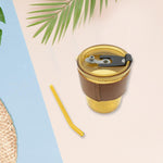 Convenient clear glass mug with a protective sleeve, straw, and leakproof lid.