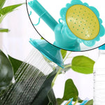 Universal plastic bottle sprinkler nozzle attachment in use for garden plants
