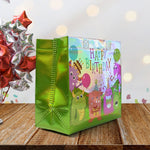 Side view of reusable birthday gift bag with mixed patterns