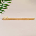 Ergonomic wooden handle of MintGuard bamboo toothbrush for comfortable grip