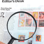 Side view of the ergonomic handle and 50mm glass lens of the reading magnifier.
