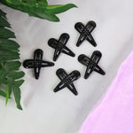 Matte finish metal hair clips arranged in pastel and bold shades