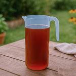 Close-up of the wide mouth crystal-clear unbreakable plastic jug with tight-fitting lid