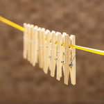 Eco-friendly bamboo cloth clips neatly displayed, highlighting their sustainable material.