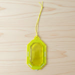 Hanging citrus gel air freshener on a towel rod