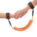 Close-up of the comfortable wrist strap of the Baby Safety Harness on a child's hand.