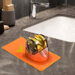 Close-up view of gold clamp on self-adhesive shower head holder