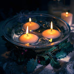 Decorative glass floating candle holder ideal for special occasions.