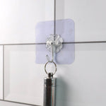 Comparison showing heavy duty adhesive wall hooks next to similar products
