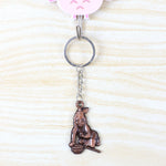 Metal Bal Krishna keychain attached to a set of keys