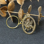 Close-up of Maa Durga Golden Keychain highlighting intricate metalwork