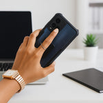 Phone ring stand fully extended, securely holding a smartphone for hands-free viewing.
