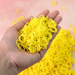 Bright orange elastic rubber bands bundled together