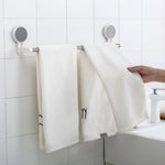 Punch-free towel rod with stable end brackets on smooth bathroom surface