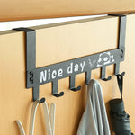 Black steel door hook rack holding bags, scarves, and coats