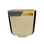 The foldable hanging trash can shown in a kitchen setting, attached to a cabinet.