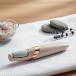 Electronic pedicure tool charging via USB, highlighting its convenient rechargeable feature.
