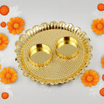 Detailed shot of the individual Kumkum bowls neatly arranged on the Puja Thali.