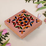 Square-shaped wooden bajot with detailed Meenakari artwork for puja rituals.