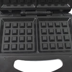 Close-up of the cool-touch handle and indicator lights on the Dabster sandwich maker.