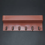 Angled view of the multi-use Key Holder Stand displaying its sleek design and ample space for organization.
