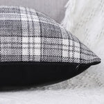Detail shot of the soft faux leather side of a decorative cushion case.