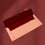 Open view of a wedding gift envelope showing space for Indian currency notes.