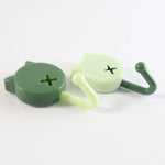 Sticky adhesive base of self adhesive round wall hooks showing strong adhesive pad