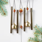 Lord Ganesh Wind Chimes displayed in garden setting creating peaceful ambiance