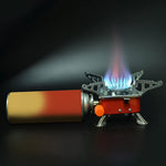 The windproof Mini Camping Stove in a natural outdoor setting, ideal for hiking and backpacking adventures.