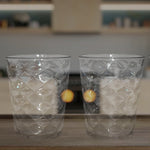 Side view of pyramid plastic glass showcasing wide stable base