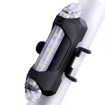 Rechargeable LED bicycle light with USB charging port for convenient power.