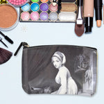 Organivo Portable Storage Bag holding small items like pens and cards.