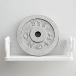 Stylish elephant wall shelf organizing small items on a bathroom wall.