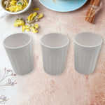 Side view of a single unbreakable plastic tea cup on a clean background.