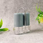 Hand holding an ergonomic acrylic salt shaker for comfortable use