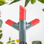 The 360° rotating sprinkler arms distributing water evenly across a yard.